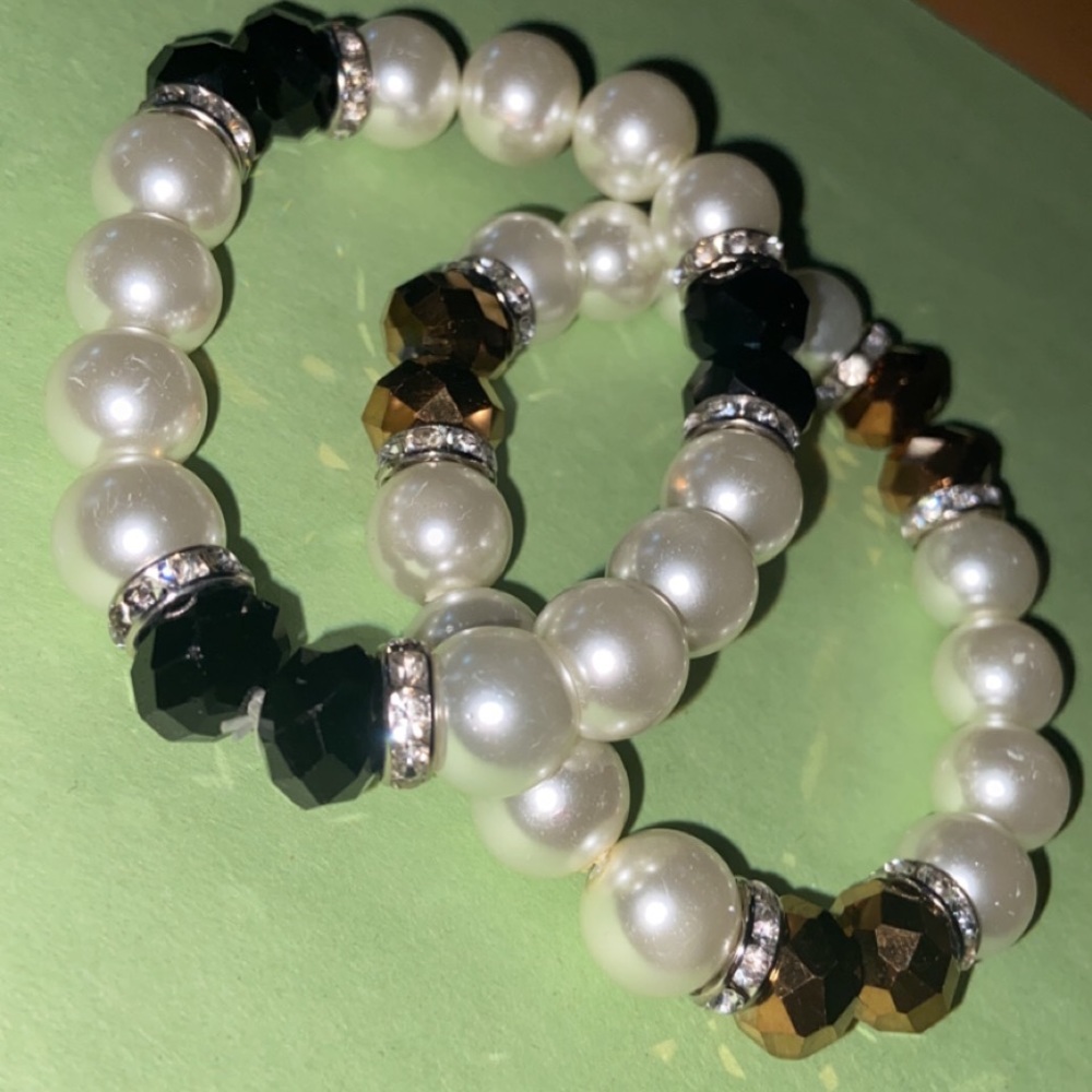 Black, brown, and white bracelets